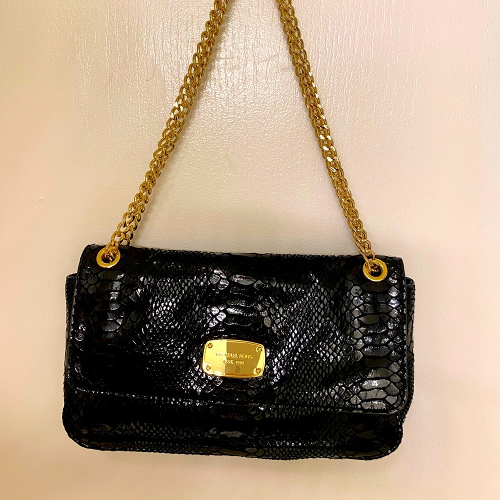 Perfect condition Michael Kors clutch in black snake w/ adjustable gold chain